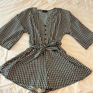 Green/black Vici Dolls romper.